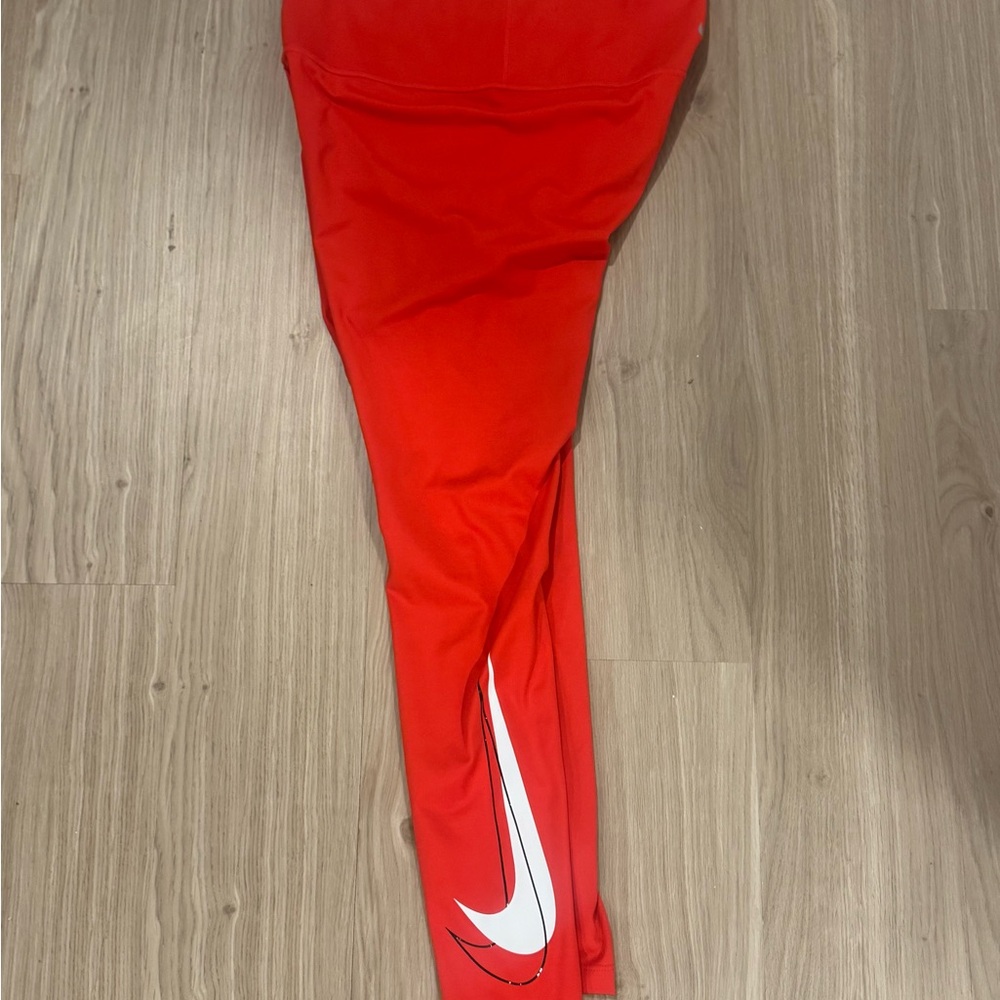 Nike women’s Bright Red Leggings with White Swoosh